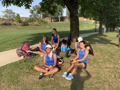 JV Girls take a break under the tree between their matches. 