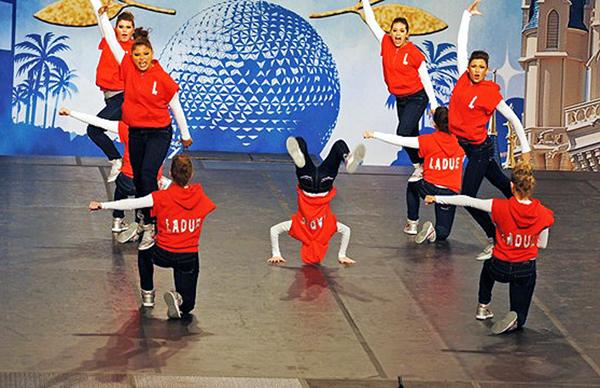 As the Laduettes perform on the Nationals stage at Disney World in Orlando, Feb. 5, sophomore Rachel Taryle rocks a center-stage handstand. Surrounding her are fellow poms teammates giving the dance their all and placing 19th in the nation, making 2012 their second consecutive top-20 appearance.