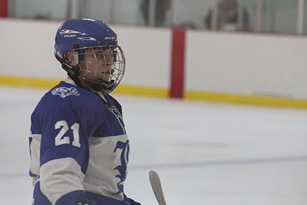 Junior Jake Gould waits for the puck before the face-off. Gould scored one goal in Ladues 8-2 victory over Whitfield. 