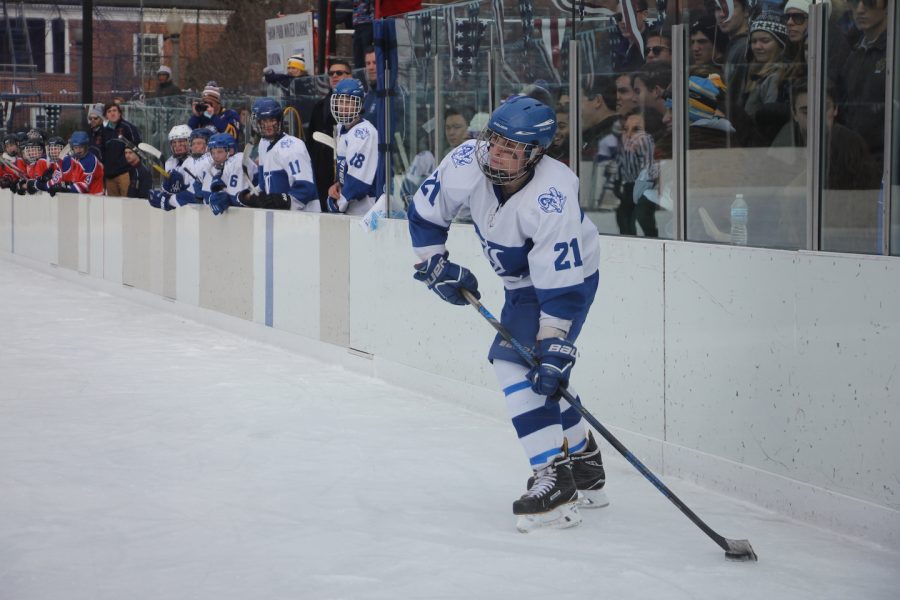 Junior Jake Gould looks to pass the puck through the middle of the ice in the Winter Classic. Ladue won the exhibition game 7-0.