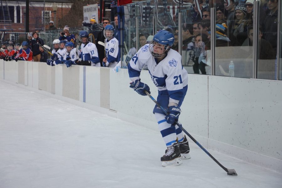 Junior Jake Gould looks to pass the puck through the middle of the ice in the Winter Classic. Ladue won the exhibition game 7-0.