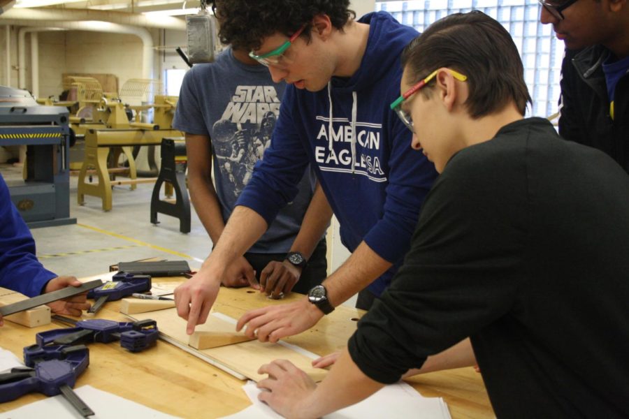 Senior Vinicius Fernandes and freshman Matthew Levy go over the measurements for the robot.
Friday, Feb. 9