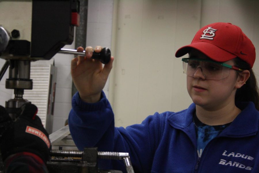 Junior Megan McGinnis drills a hole in the frame of the robot.
Friday, Feb. 9