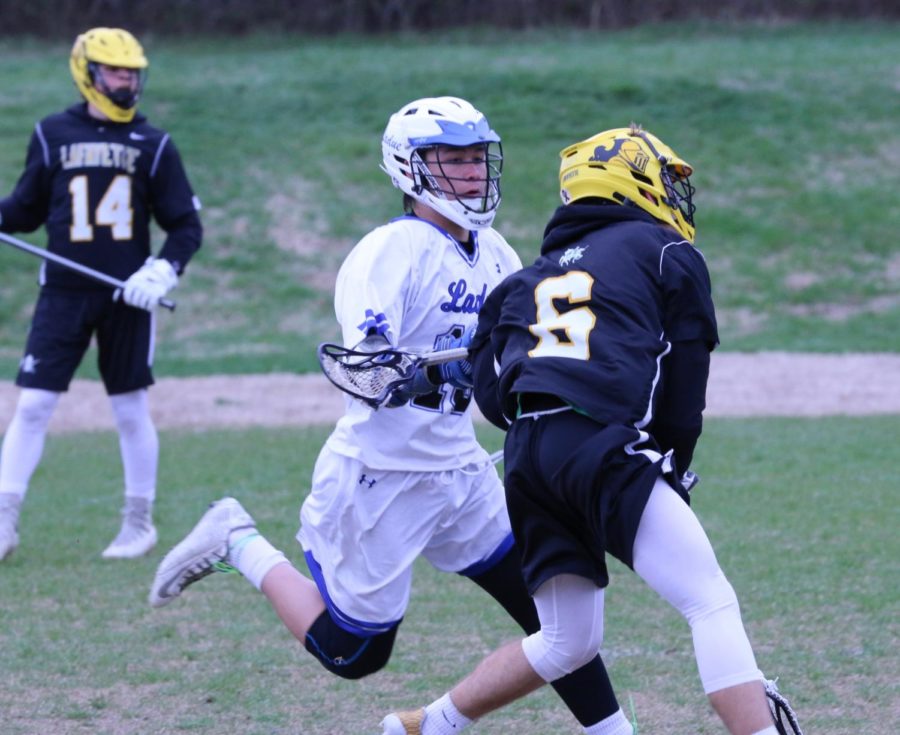 On Friday, April 6th, The Ladue Boys Varsity Lacrosse team played against Lafayette.  Ladue was defeated  15-2.  Julien Peng squares up to #6.