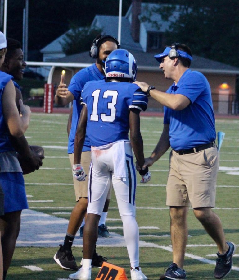 Junior+Mason+Player+talks+with+head+Coach+Tarpey+after+making+an+exceptional+play+for+the+team.+The+coaches+offered+positive+feedback+and+kept+a+level+head+throughout+the+game.++