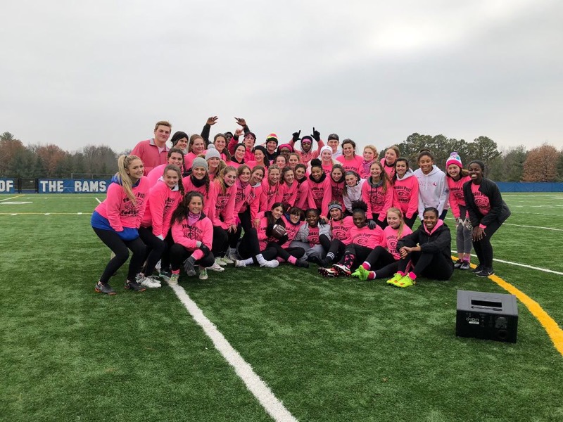 Ladues Powderpuff participants huddle together for a group picture. (Photo courtesy of Madison Grady)