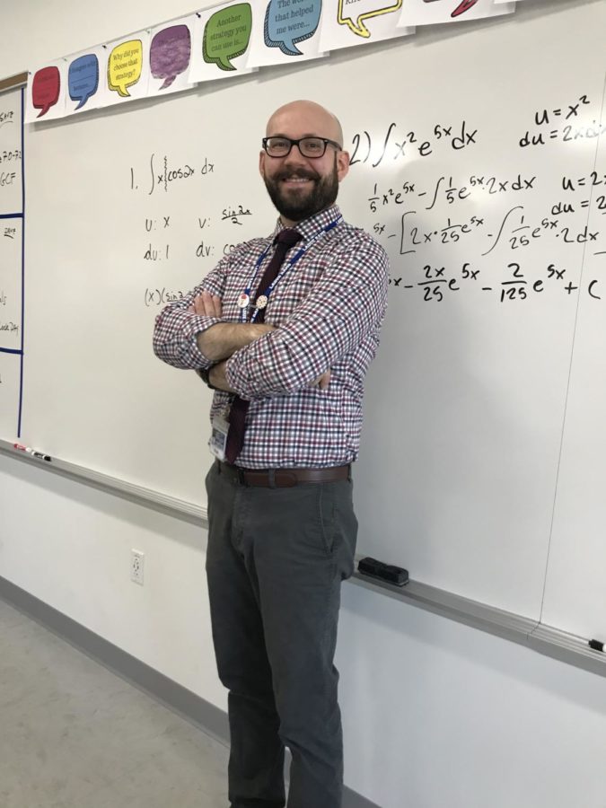 Mr. Farrell poses in front of his whiteboard after AP Calculus BC