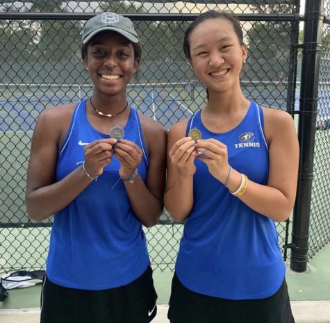 Saba Fajors and Megan Ouyang smile for a picture after qualifying to state. The girls are the number one and number two on the varsity tennis team. “I am very excited for state and to see how the competition is like,” Fajors said. “I just want to win a match. It’s going to be awesome.”
