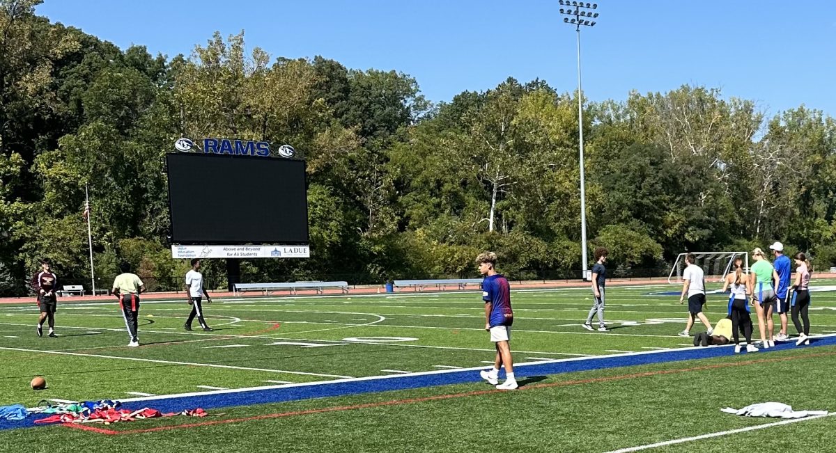 The freshman P.E. class prepares for a game of flag football at Ladue Horton Watkins High School Sept. 18. After participating in a class warm up, students grabbed their flags and got in position for the game that awaited them. 
