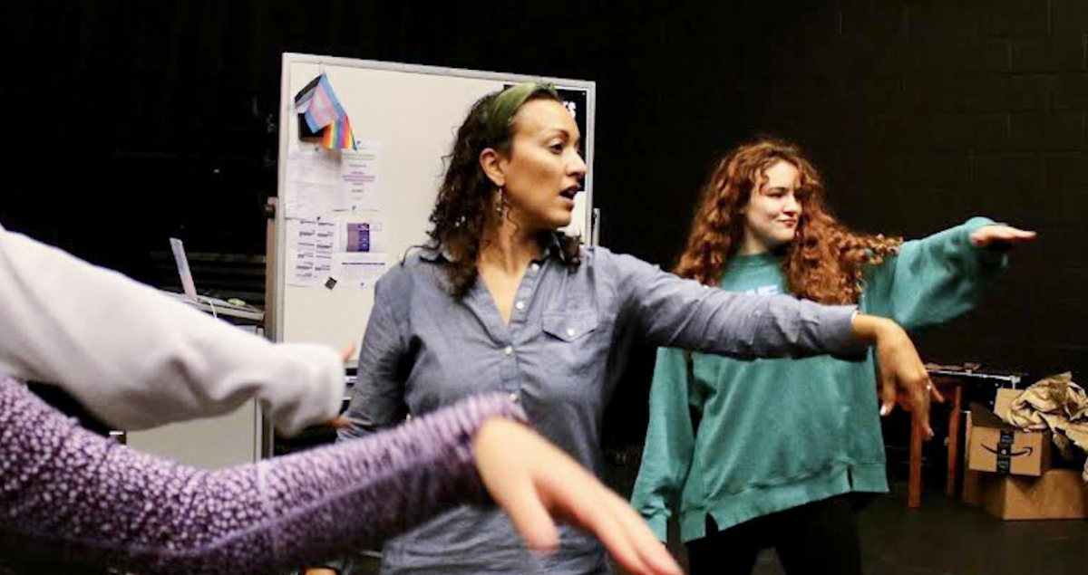 Jessica Winingham conducts a group shake-out amongst the “Puffs” cast and crew. Winingham always made sure to begin rehearsals with some form of exercise. “Warm-ups are essential for the cast and crew in order for them to prepare their minds and bodies for rehearsal,” Winingham said. “It also serves as [a] transition from school into the sacred space of rehearsal.” 