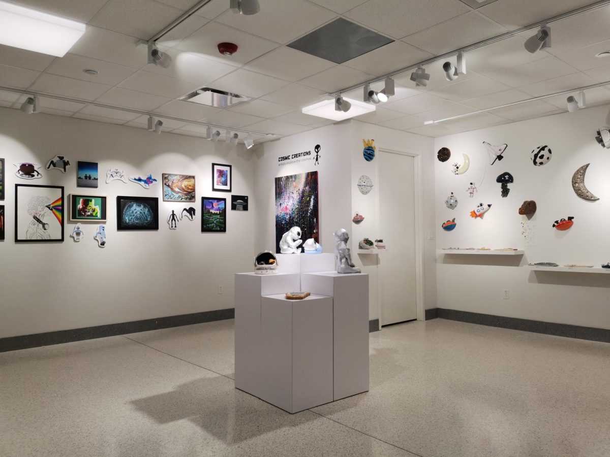 Student artwork is displayed in the Spirtas Gallery as a part of the new exhibition, “Cosmic Creations: Artists Explore the Cosmos.” During the big renovation in 2018, Raedeke requested for a student gallery to be built in a place that is centrally located within the school. “It thought it would be a great opportunity for students to showcase their work so that everybody could see it,” Raedeke said. “It wasnt just tucked away in some corner [that] nobody goes in.”