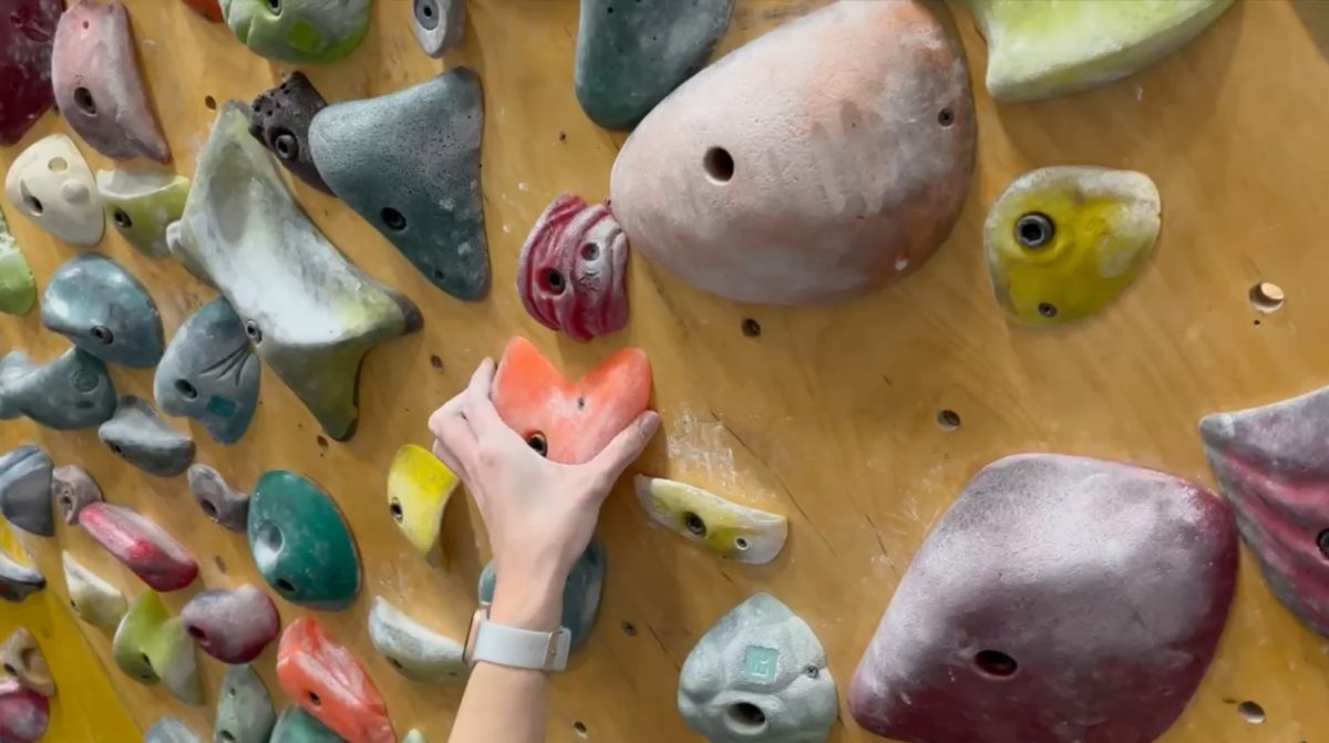 In the Upper Limits Climbing Gym, Julia refines her climbing skills. She practiced there with her sister, Addie, and some other friends in the climbing community.  "The climbing community is really small, so it's super tight-knit," Julia said. "Everybody is really supportive of each other. We're all trying to be better climbers together." 