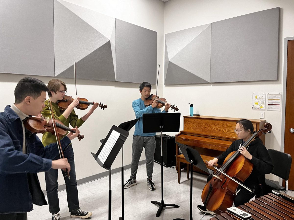 (From left to right) Adam Ye (11), Hayden Baker (10), Alex Farn (11) and Margaret Leung (11) rehearse chamber music together. The group was sight reading to get to know each other better as musicians. Its just fun to play with others, Leung said. Especially in full orchestras and chamber since playing solo doesnt have the same feeling [as] playing with another person.