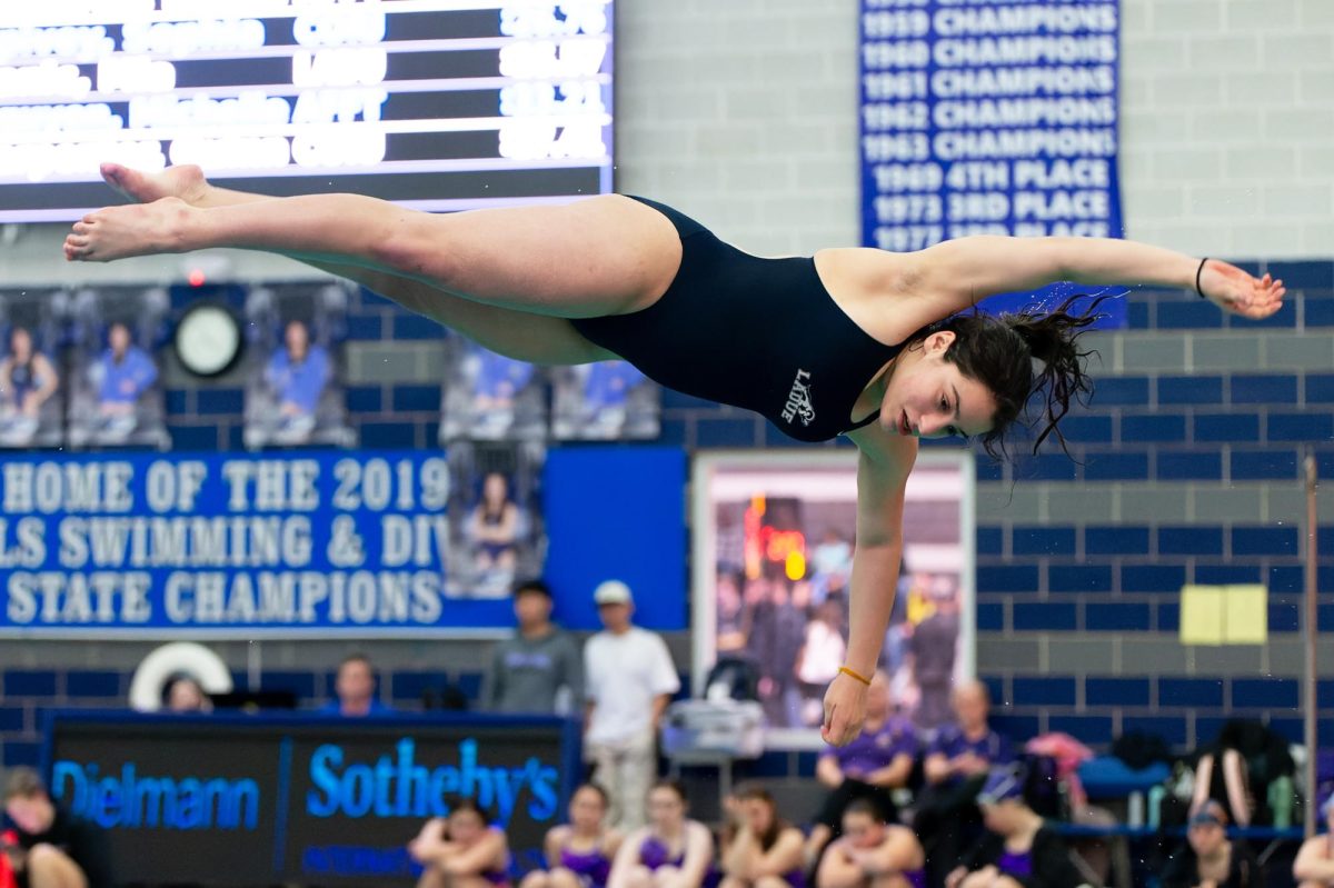 Abi Loiterstein (11) performs a dive routine. Ladue placed second overall behind Cor Jesu Jan. 9. “I’m really proud of the team this year, it’s a really great group,” Loiterstein said. 