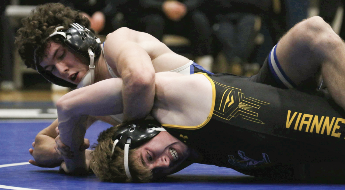 Jimmy Rowe (12) pins an opponent from Vianney. Rowe placed second at the St. Charles Invitational that took place Jan.
13-14. “I’m proud of how much everyone on the team is getting better and pushing me to be better,” Rowe said. 