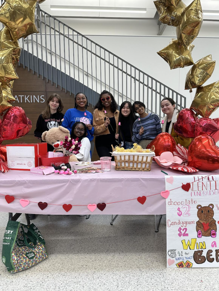 FemCo poses for a picture at their fundraiser table Feb. 12. The club had been selling gifts during the lunches leading up to Valentines Day to raise money. “FemCo is an intersectional feminist club where we focus on feminist discussions on theory and intersectionality, Betlehime Gema (12) said.