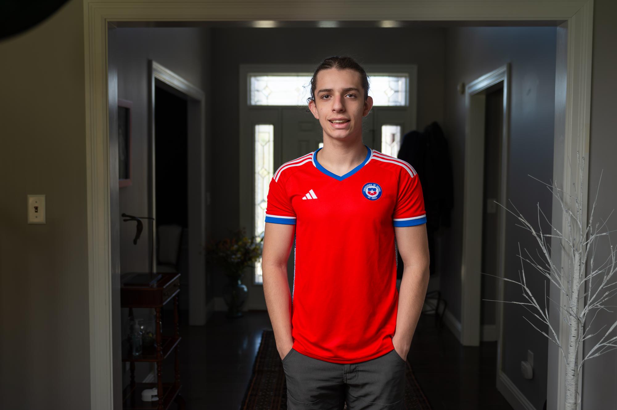 Junior Eduardo Naranjo dons a Chilean soccer jersey. He watched soccer games often with his family. "Whenever the Chilean team was playing in a World Cup match, we would watch it," Eduardo said. 