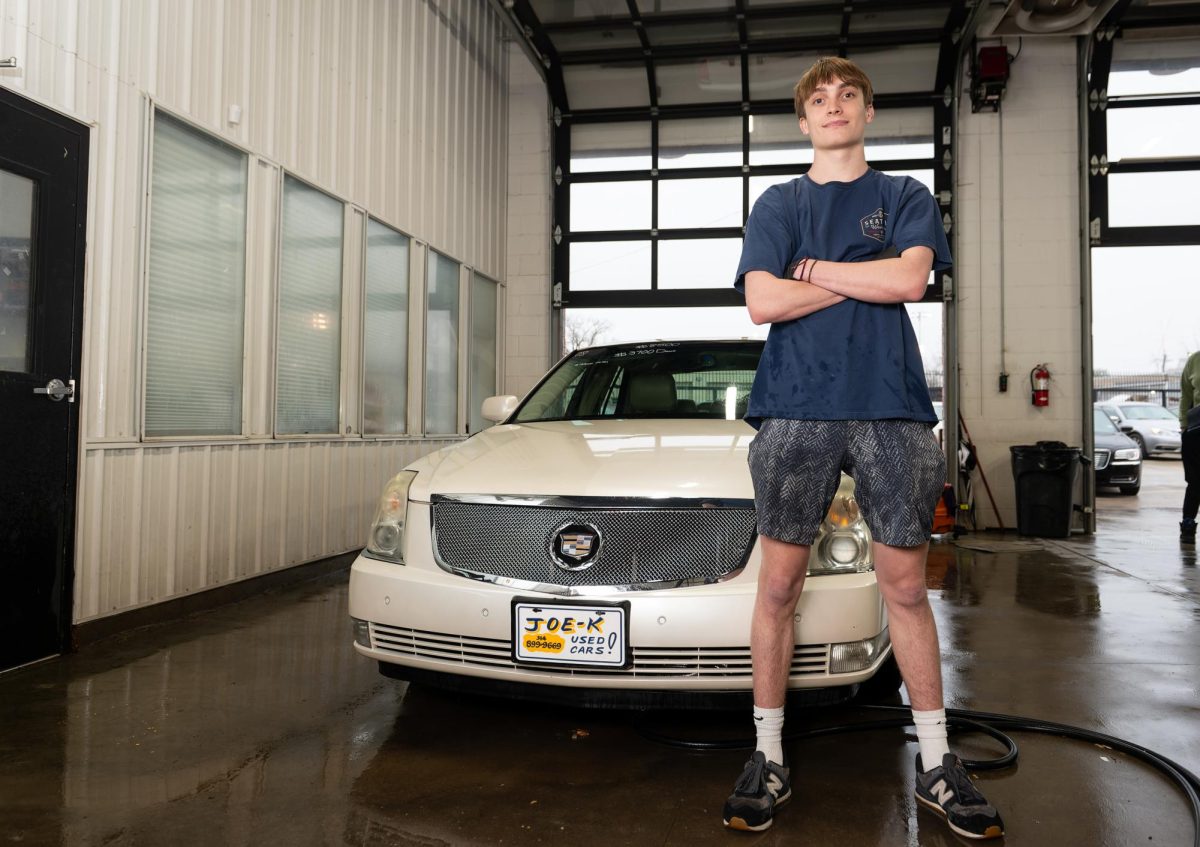 Joe Kaminski stands next to a recently detailed car in his dad’s dealership. Joe K’s Used Cars has been in business for over 10 years. “My dad broke off from my grandpa and began the dealership because he knew how to do it and wanted to start something of his own,” Kaminski (12) said. 
