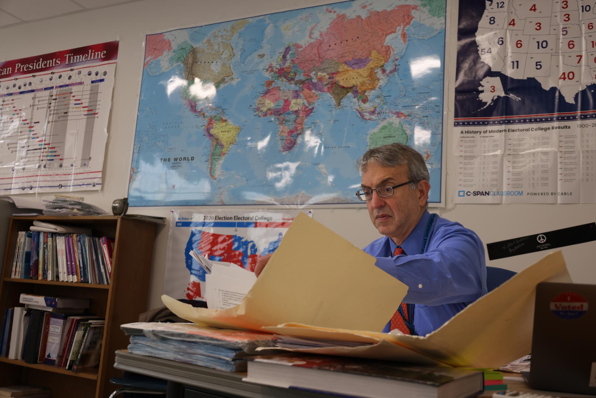 Teacher Robert Snidman grades papers after school. Prior to teaching at Ladue, Snidman faced unexpected adversity at Hazelwood. “[There was] open drug dealing in the bathrooms and in the back of classrooms," Snidman said. "I did my best for five years."