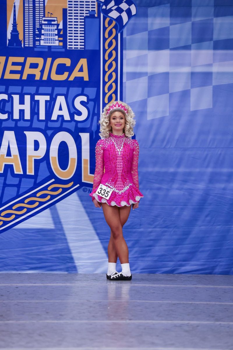 Freshman Tori Fox dances onstage at the 2023 Oireachtas. Many of her teammates watched her dance and praised her after she received her placement. The support of Fox's teammamtes empowered her. “When I got third [at Oireachtas], everybody just started crying for my friend and I because we were top three together,” Fox said. “When I came off stage, everybody was just running over and trying to hug me."