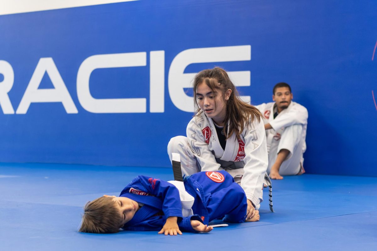 Yaya Ungacta (10) assistant teaches Brazilian jiu-jitsu at the Gracie Barra martial arts school in Chesterfield. She teaches four days out of the week for about an hour after school. It used to be her father’s favorite thing to do back in Guam. Ungacta’s parents had her learn martial arts when she turned 10 years old. She started with mixed martial arts at the same studio where she found jiu-jitsu. She has been doing jiu-jitsu for the past five years. “[In BJJ,] we focus on different moves every week but we always have a theme,” Ungacta said. “For example this week, we are focused on takedowns.”