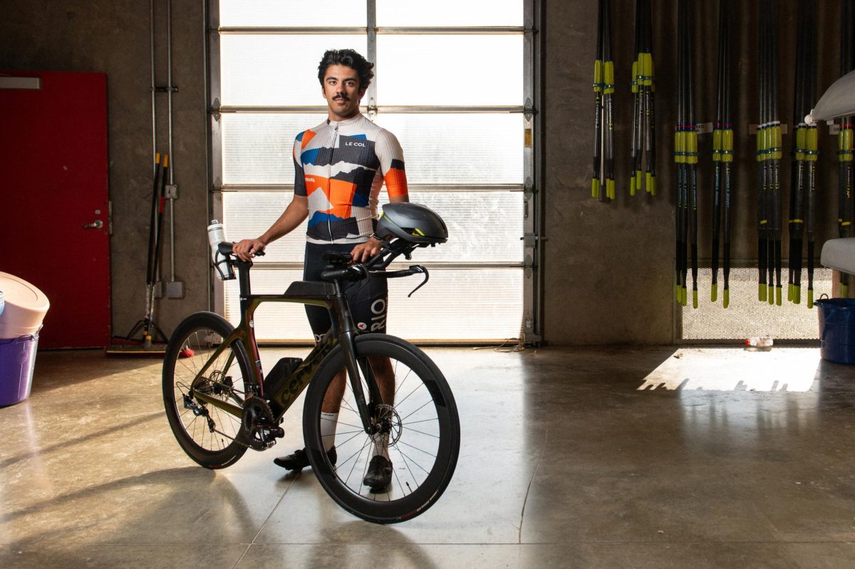 Karan Vatwani (12) stands with his bike in the St. Louis Rowing Club boathouse Oct. 20 at Creve Coeur Lake in Maryland Heights. Vatwani is a member of the Wheelhouse Racing Team, participating in several triathlons each year that consist of long-distance swimming, cycling and running. He competed at the USA Triathlon Olympic Distance National Championship in Atlantic City, New Jersey in September, which qualified him for the 2025 World Triathlon Championships Finals in Australia. A rower since his freshman year, Vatwani began training for triathlons with his friends over summer break in 2023. “It started out as just kind of something to do for fun,” Vatwani said. “I just decided it’s something I should pick up over the summer when I’m not rowing or biking.”