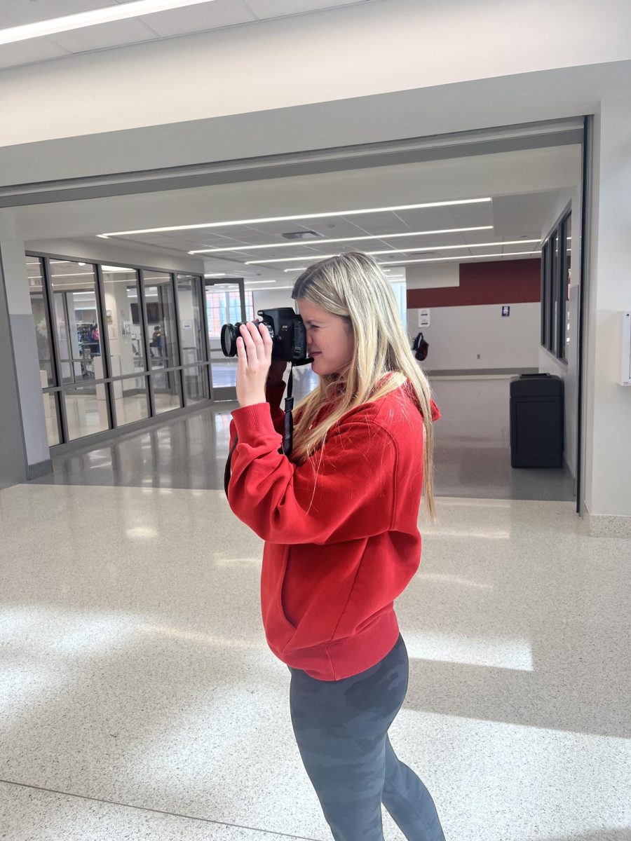 McKenzie Durbin takes photos during photography class. The class has been working with lighting and shadows. "I enjoy photography because we get to go around the school and take fun pictures," Durbin said.