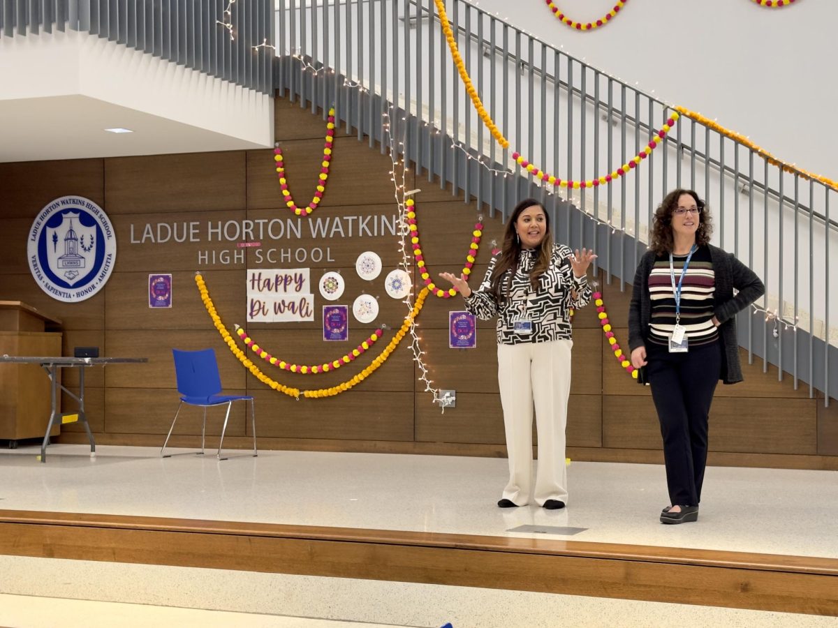 Stephanie Bellville and Deepa Jaswal stand on the stage announcing the performance of the Bollywood Dance Club. They worked with the Asian Culture and Advocacy Group to arrange this event. "The Bollywood Dance Club did their first school performance this year which was so exciting," Jaswal said.