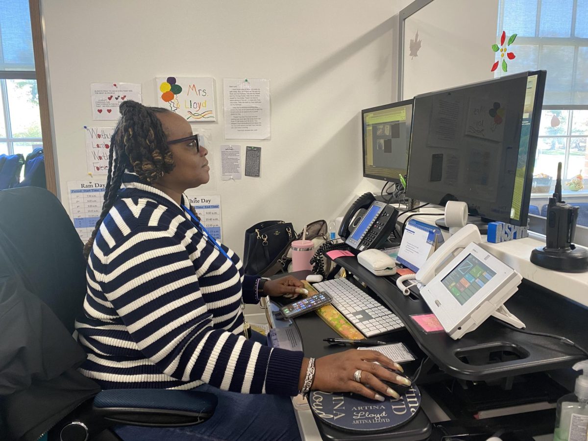 Receptionist Artina Clark-Lloyd works on her computer as a receptionist allowing students in and out of the building. Clark-Lloyd has been at Ladue for 3 years and loves her time here. "The best part that I like the most about being a receptionist is getting to know the students as well as the parents," Clark-Lloyd said.