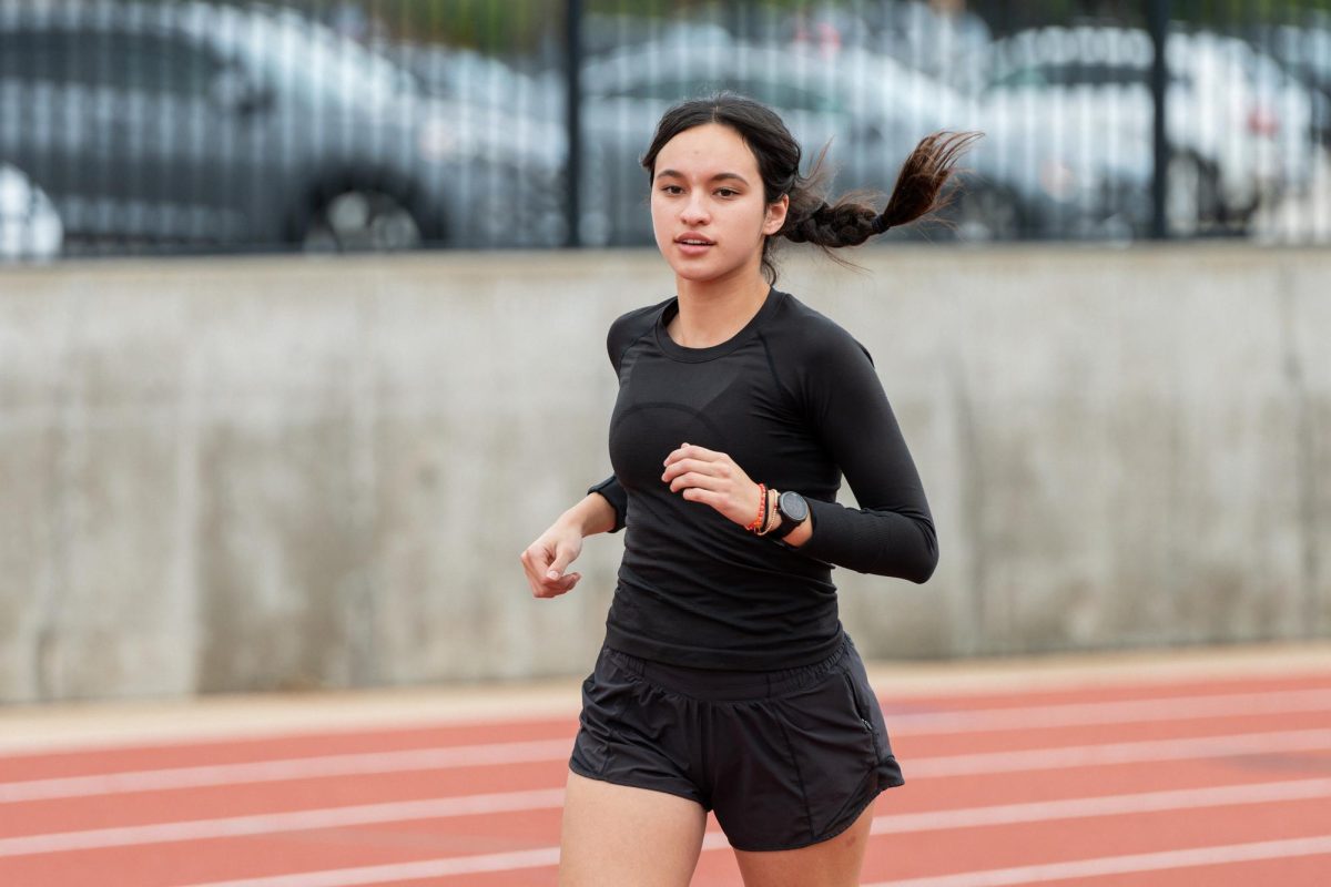 Alexandra Tsygankov (12) runs on the track Nov. 18. She has run cross country for the last four years, since her freshman year. “It’s going to be the friendships and the person you grow [into] that’s gonna matter more than anything,” Tsygankov said.