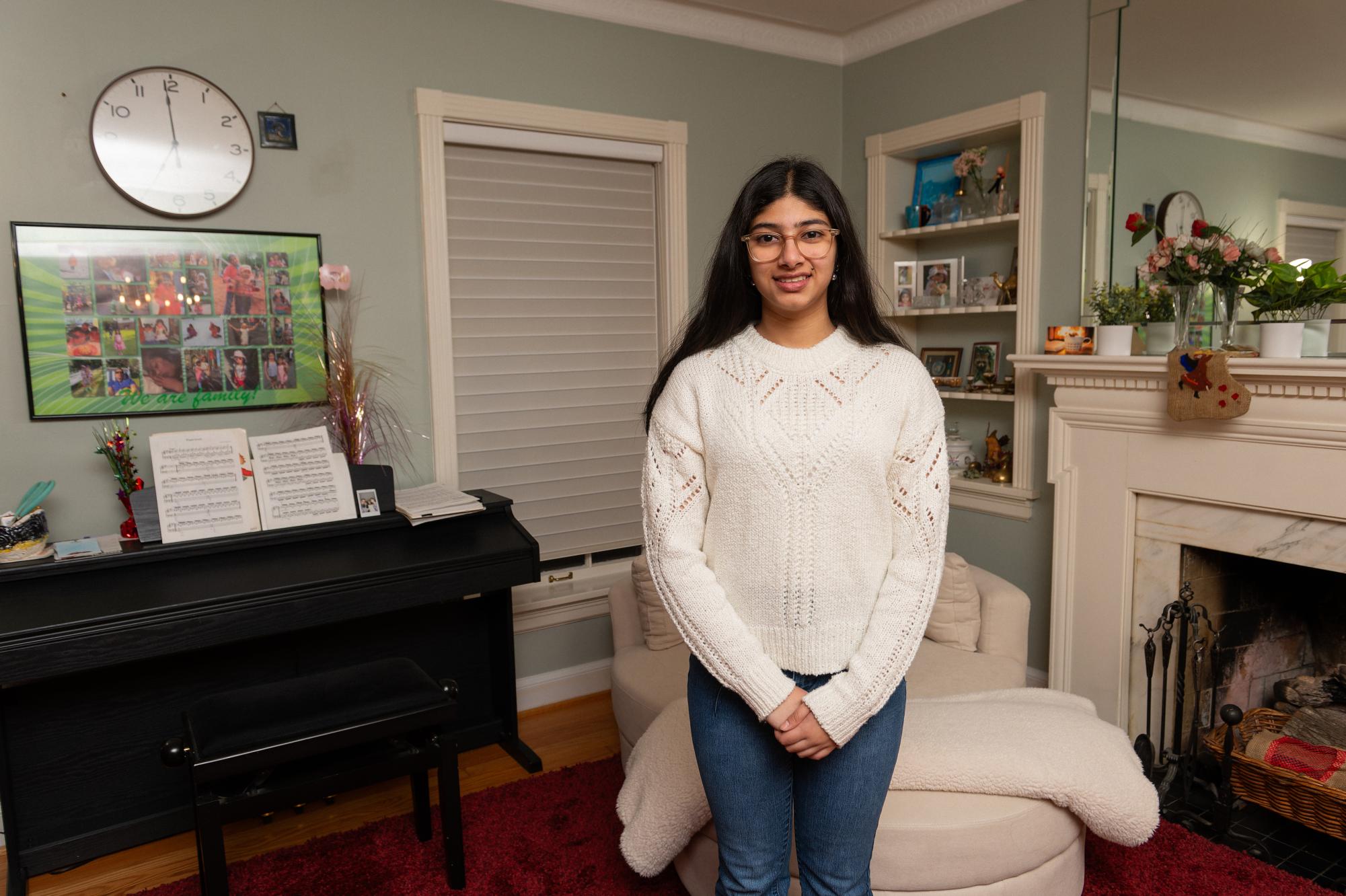 Sanvi Prasad (11) stands in her home, filled with cultural trinkets and decorations. They reminded Sanvi of her old life in Germany, which she still made frequent trips back to. “I went back to Germany and saw the places that used to be my everyday life,” Sanvi said. “That gave me closure, that visit to Berlin."