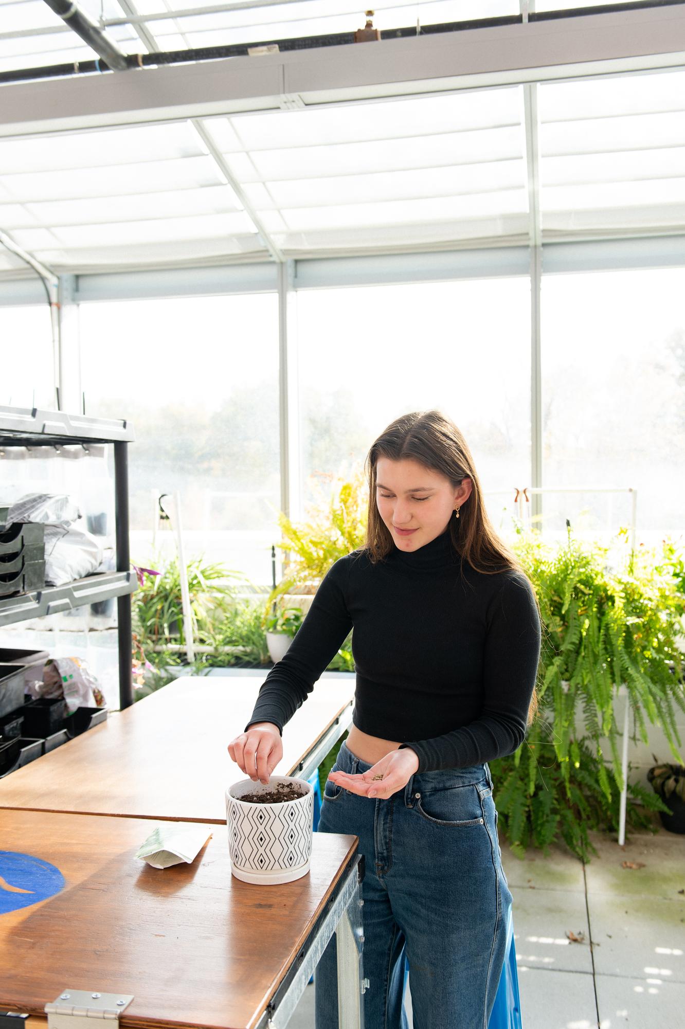 Sophie Cowlen (10) stands in Ladue High School’s greenhouse sowing seeds in a pot of soil. With plenty of experience growing her own plants since a young age, Sophie also has plenty of knowledge in growing healthy plants and advising based on her personal understanding. “I think sunlight is the biggest thing,” Sophie said. “Having a good location, good soil and watering consistently [is also important]. And [gardening] also requires planning and making a calendar, so that way you can plan
when you’re going to plant and harvest.”