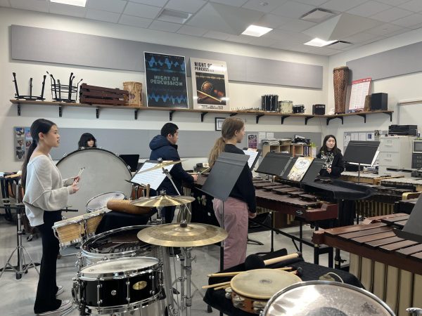 Percussion students listen to feedback on their playing of the piece “The Lost” from Percussion teacher Elstner. Concert and symphonic percussion classes have different pieces to play for Night of Percussion. “We start practicing this early because we have limited amounts of rehearsals. Time runs out very quickly for us especially since this year we have four long pieces to play that require lots of practice and coordination between all players,” Hiken said. 