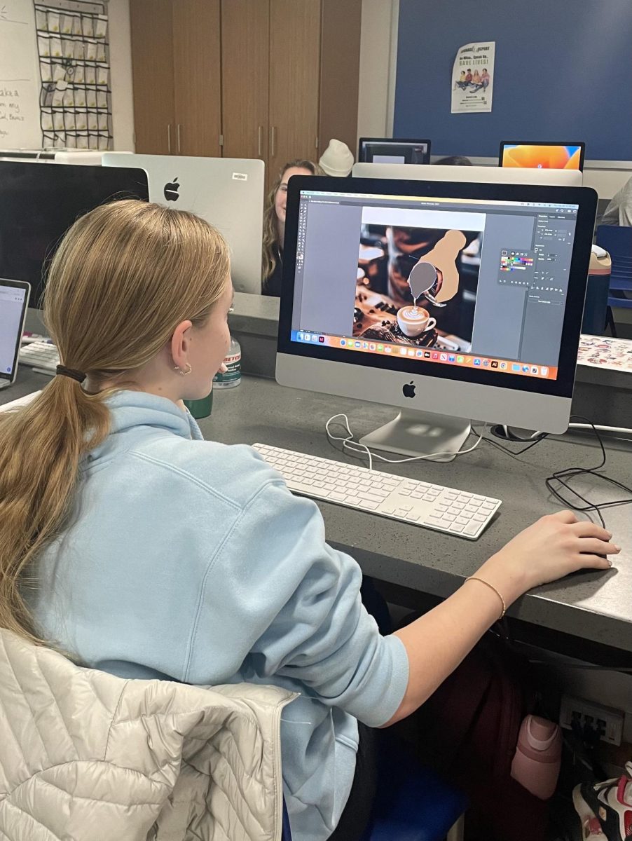 Abby Hellmann (9) works on her logo assignment, one of the many projects completed in Graphic Design. "We traced an animal and we did different customizations and it's a really fun class." Hellmann said. 

