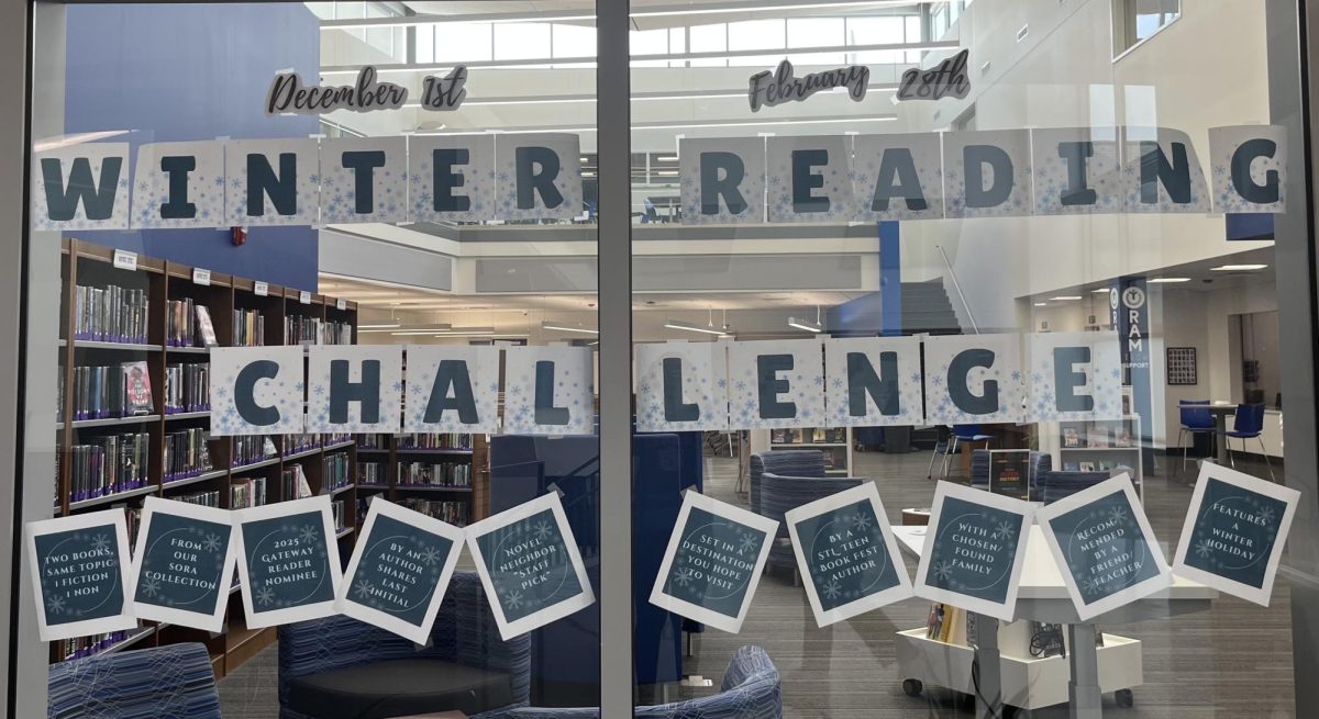 A sign with the categories and dates of the Winter Reading Challenge is posted in the library window. Students can submit their reading until February 28. "This year, we came up with different categories and anybody could pick at least three," Mortland said. 