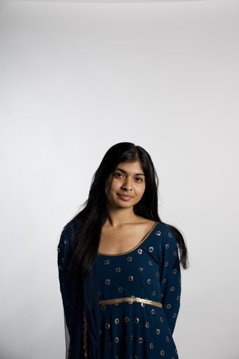 Captions: Stuti Dasgupta (12) shows off a cultural garment known as a salwar kameez. The clothing originated in India and the way it is draped differs between regions. “I think cultural identity is really important,” Stuti said. “I think it made me who I am because there’s not many Bengali people in Ladue.” 